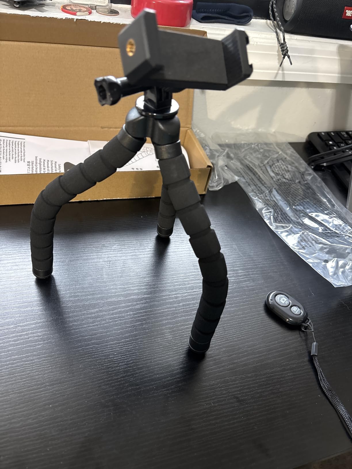 Amazon Basics Portable and Flexible Tripod with Wireless Remote and Smartphone Clamp, 10-inch long, Black - Customer Photo 2